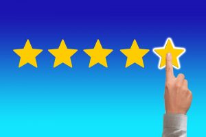 a five star review and a finger pointing to it