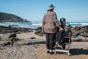 Elderly sitting at the beach
