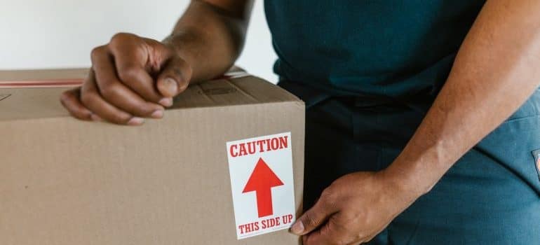 Man packing a moving box
