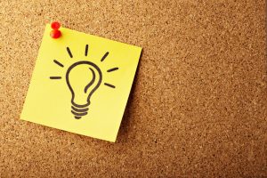 A drawn light bulb on a stick note