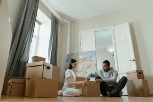 a couple with moving boxes