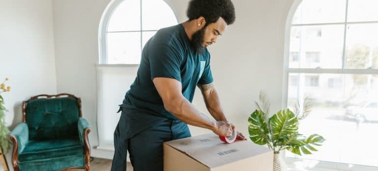 a man packing plants for moving