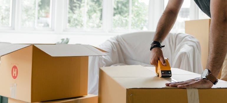 A man packing boxes.